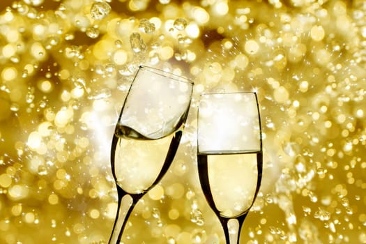 Champangne glasses on sparkling background