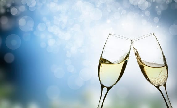 Champangne glasses on sparkling background