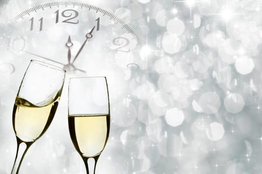 Glasses with champagne against holiday lights and clock close to midnight