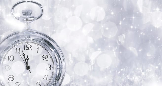 New Year's at midnight - Old clock with stars snowflakes and holiday lights
