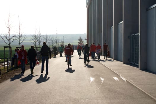 Mainz,Germany – March 09,2014: Fans of the Bundesliga club FSV Mainz 05 go to a football match at the Co Face Arena on March 9,2014 in Mainz.
