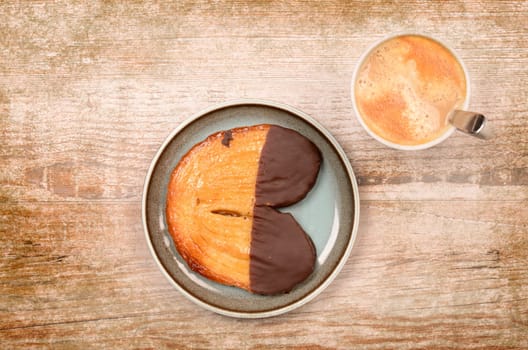 Sweet baked cookie with a cup of coffee