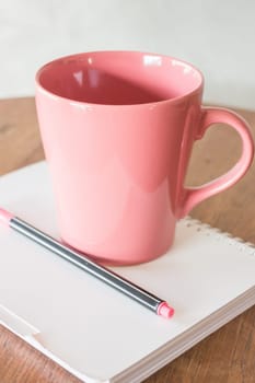 Beautiful hot drink mug and notepaper, stock photo