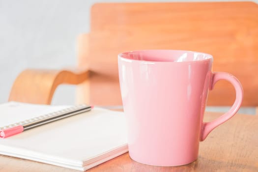 Freelance work table with notepaper and coffee, stock photo