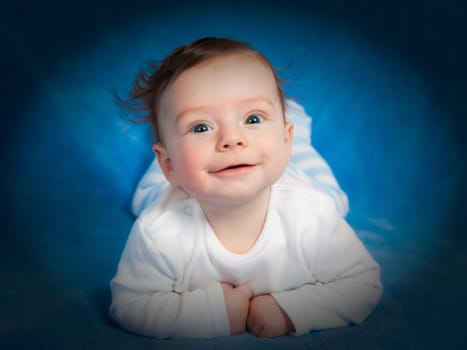 Portrait of 4 months old baby boy at home.