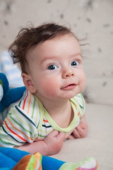 Portrait of 4 months old baby boy at home.