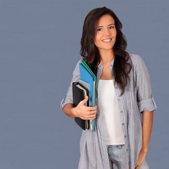 Student holding pile of files