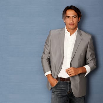 Handsome latin man leaning on wall