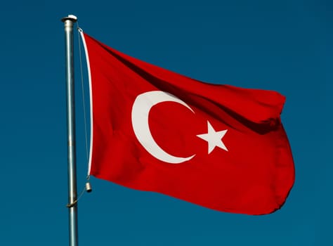 Turkish national flag over blue sky