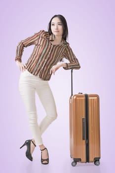 Modern Asian woman stand with a luggage.