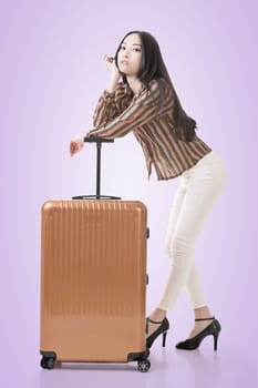 Modern Asian woman stand with a luggage.