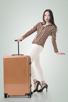 Modern Asian woman stand with a luggage.