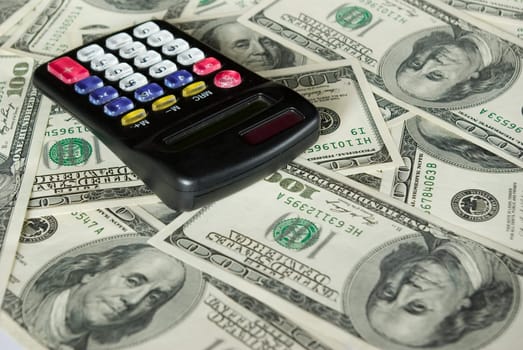 calculator on a background dollars