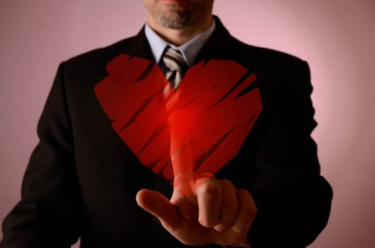 Man is pushing a red heart shape