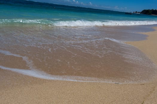 Beautiful secluded sandy beach in the Caribbean with white sand and blue sky as in paradise