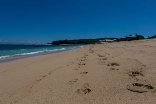 Beautiful secluded sandy beach in the Caribbean with white sand and blue sky as in paradise