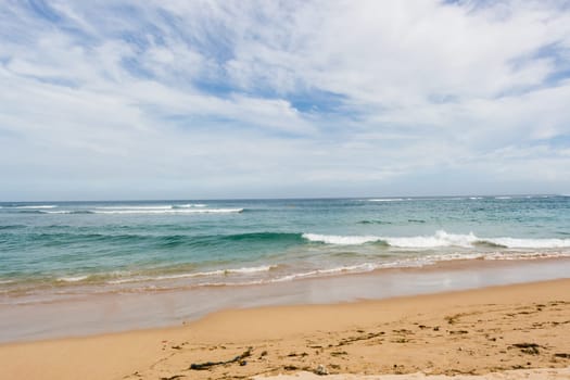 Beautiful secluded sandy beach in the Caribbean with white sand and blue sky as in paradise