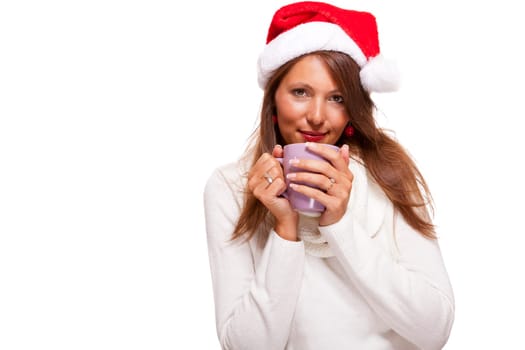 Attractive young woman with red Santa hat drinks a hot cup of coffee she weighs in her hands to warm her hands Insulated freeagent