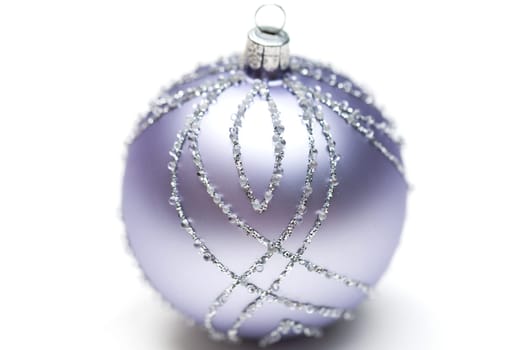 Glittering silver Christmas bauble on white background Macro detail