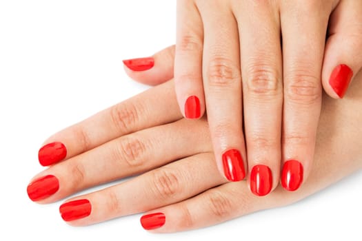 Women's hands with beautiful well-groomed fingers and red nail polish wellness beauty spa close up isolated on white background