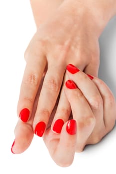 Women's hands with beautiful well-groomed fingers and red nail polish wellness beauty spa close up isolated on white background
