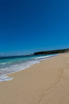 Beautiful secluded sandy beach in the Caribbean with white sand and blue sky as in paradise