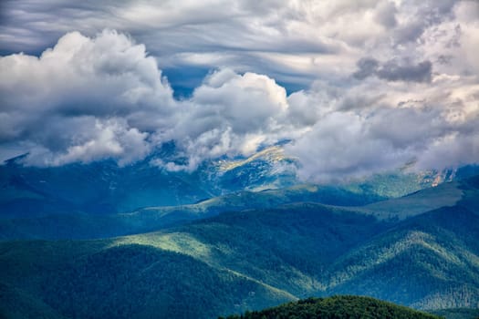 Cloudy landscape of the alpine area seen from the Transalpina road in Romania.