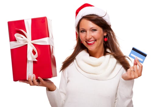 Attractive woman with red Santa hat with a large red Christmas gift and bank card credit card isolated on white freeholder text space