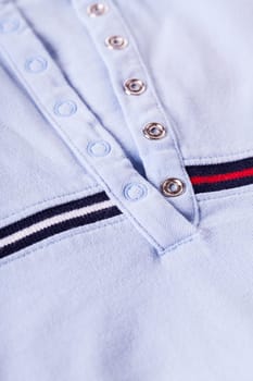 Shirt with button placket with silver snaps and stripes texture as close-up background