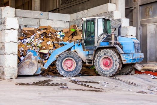 Shovel loader wheel loader with large shovel in the construction industry in the open air in daylight