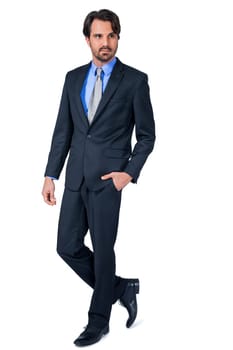 Self-proclaimed young businessman with suit dark hair and beard isolated against white background