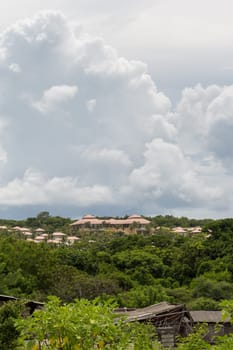 House roof in a plantation in a rich vegetation with cloudy skies in Singapore