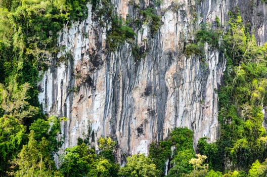 Stripes of rock cliff on limestone mountain