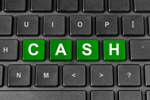 financial cash green word on keyboard