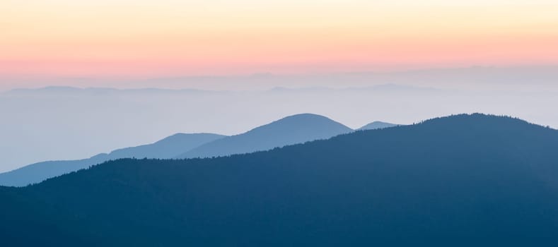 Panorama  of mountain ridges silhouettes