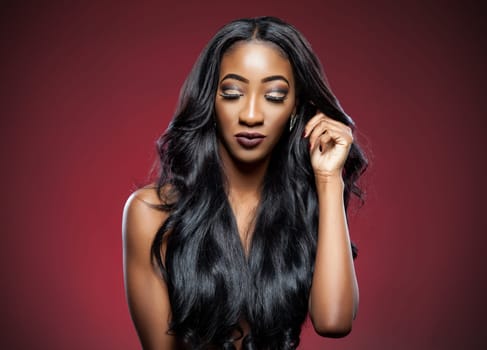 Black beautiful woman with long luxurious shiny hair