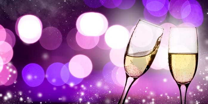 Champangne glasses on sparkling background