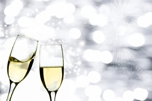 Champangne glasses on sparkling background