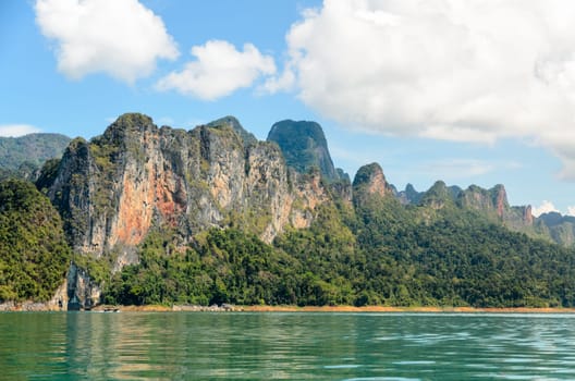 High mountain range above the green lake at Ratchapapha dam in Khao Sok National Park, Surat Thani province, Guilin of Thailand.
