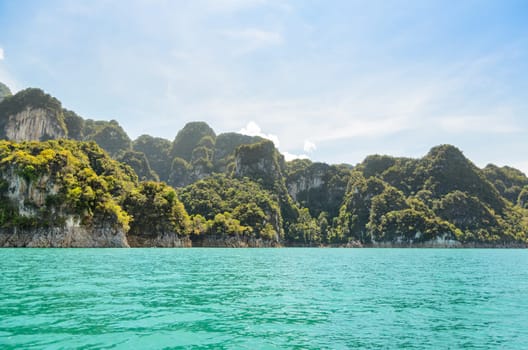 High mountain range above the green lake at Ratchapapha dam in Khao Sok National Park, Surat Thani province, Guilin of Thailand.