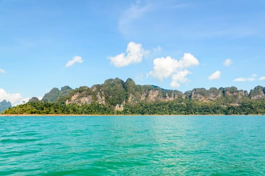 High mountain range above the green lake at Ratchapapha dam in Khao Sok National Park, Surat Thani province, Guilin of Thailand.