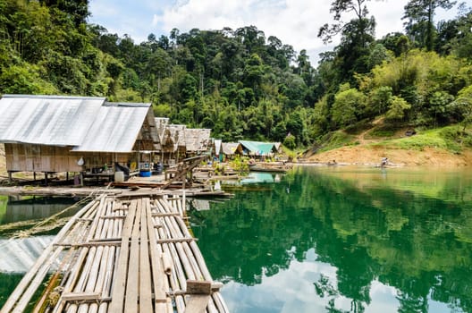 Floating home of the forest staff, Motor raft wharf in Ratchaprapha Dam at Khao Sok National Park, Surat Thani, Thailand