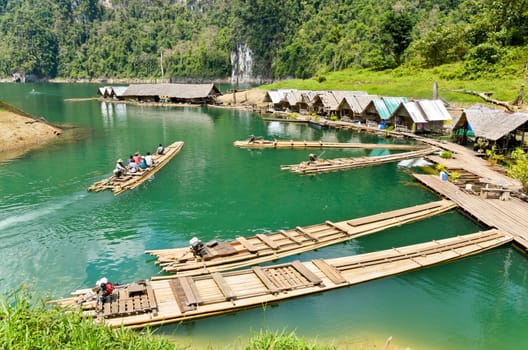 SURAT THANI, THAILAND - APR 26, 2013 : The arrival of tourists to go visit the stalactite cave by motor raft in Ratchaprapha Dam at Khao Sok National Park, APR 26, 2013 in Thailand