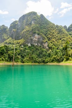 High mountain range above the green lake at Ratchapapha dam in Khao Sok National Park, Surat Thani province, Guilin of Thailand.