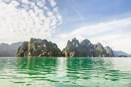 Beautiful island and green lake in summer at Ratchaprapha Dam, Khao Sok National Park, Surat Thani Province, Guilin of Thailand