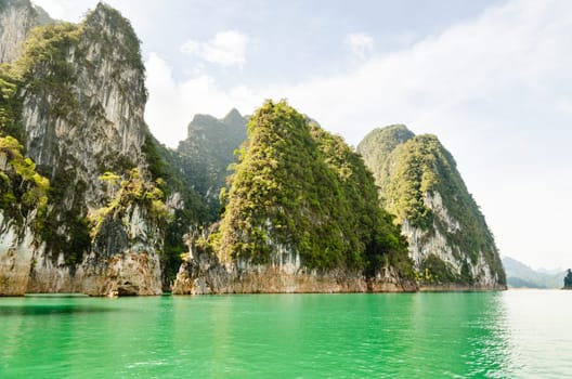 Beautiful island and green lake in the morning at Ratchaprapha Dam, Khao Sok National Park, Surat Thani Province, Thailand ( Guilin of Thailand )