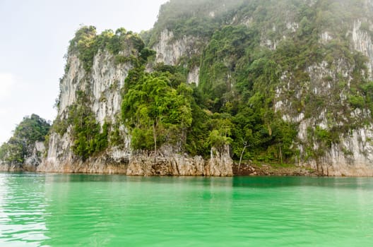 Beautiful island and green lake in the morning at Ratchaprapha Dam, Khao Sok National Park, Surat Thani Province, Thailand ( Guilin of Thailand )