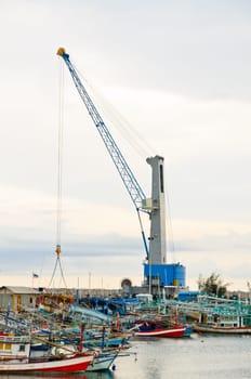 Crane for lifting a load up and down the ship in deep water harbor area of Thailand