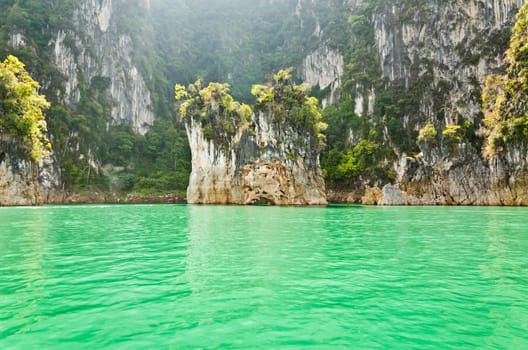 Beautiful island and green lake in the morning at Ratchaprapha Dam, Khao Sok National Park, Surat Thani Province, Thailand ( Guilin of Thailand )