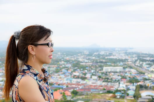 Women look at a view of the Hua Hin city from on high, Thailand